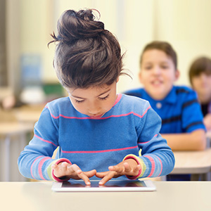 girl using tablet in class