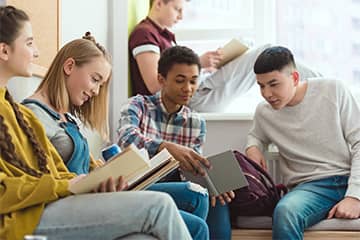 Students sitting on stairs together