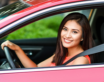 Female driving a car