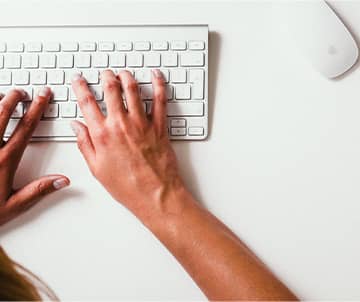 Adult using a keyboard