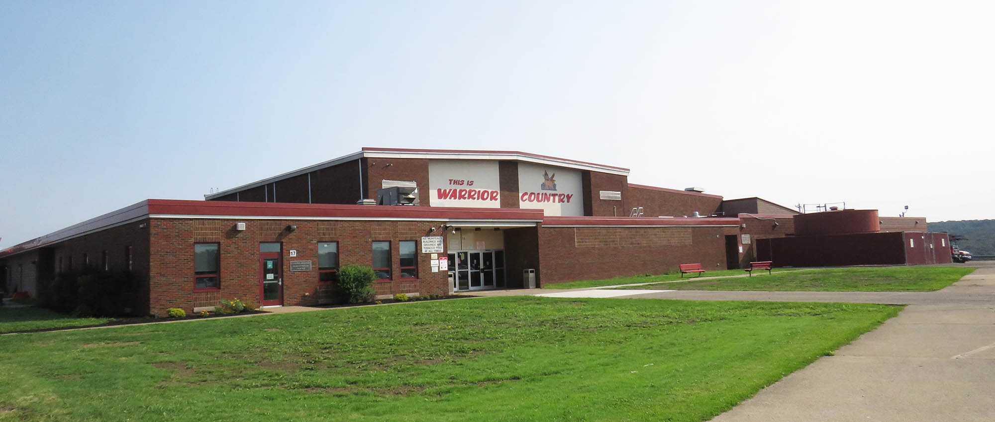 High school building with This is Warrior County mural