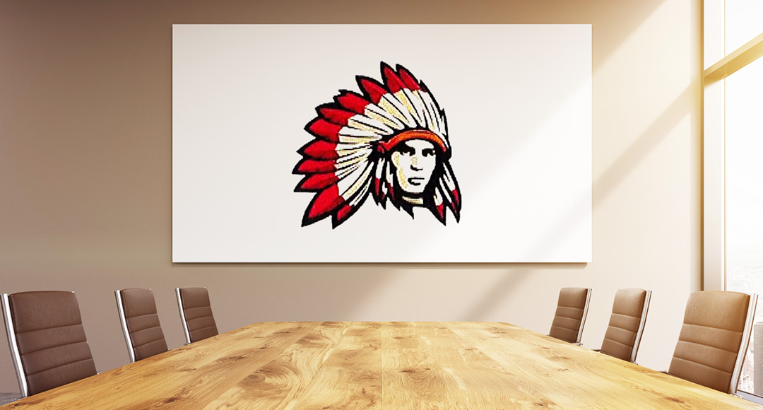 Empty board room with a beautiful painting rendition of Moniteau School District's logo
