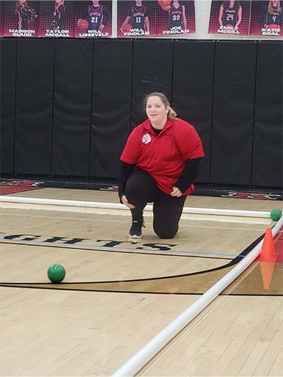 girl rolling bocceball