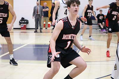 Boy in black jersey guarding