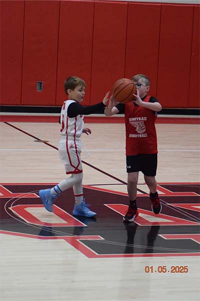 boy in red passing the ball