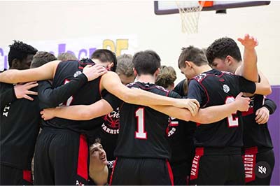boys in black huddling