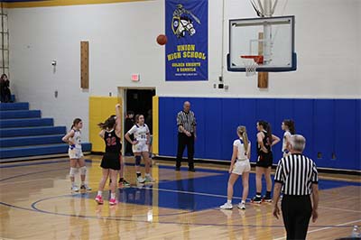 Girl in black shooting a free throw