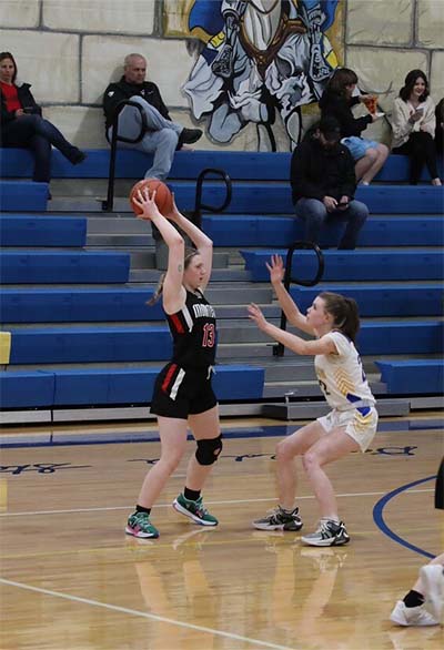 Girl in black overhand passing