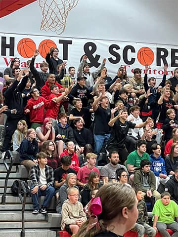Students cheering in bleachers