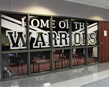 Home of the Warriors written on a classroom window