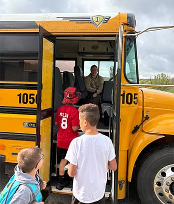 Students getting on a bus