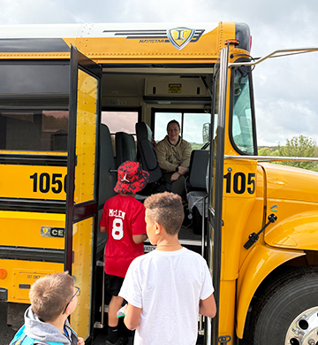 Students getting on a school bus