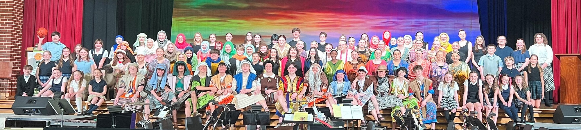 large group of students on stage