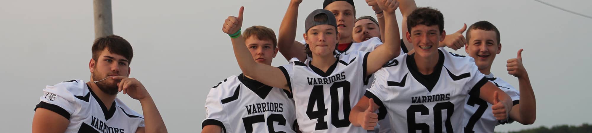 Football players in the back of a truck