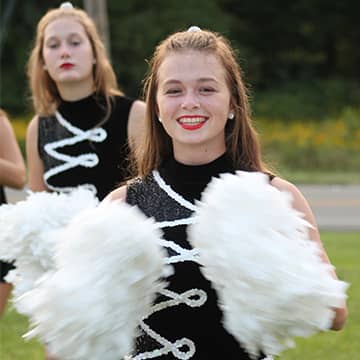 two cheerleaders outside