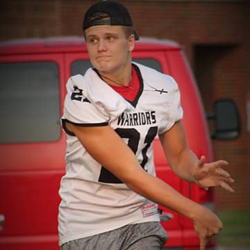 football player throwing the football