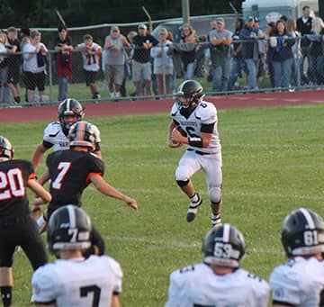Player running the football during a game