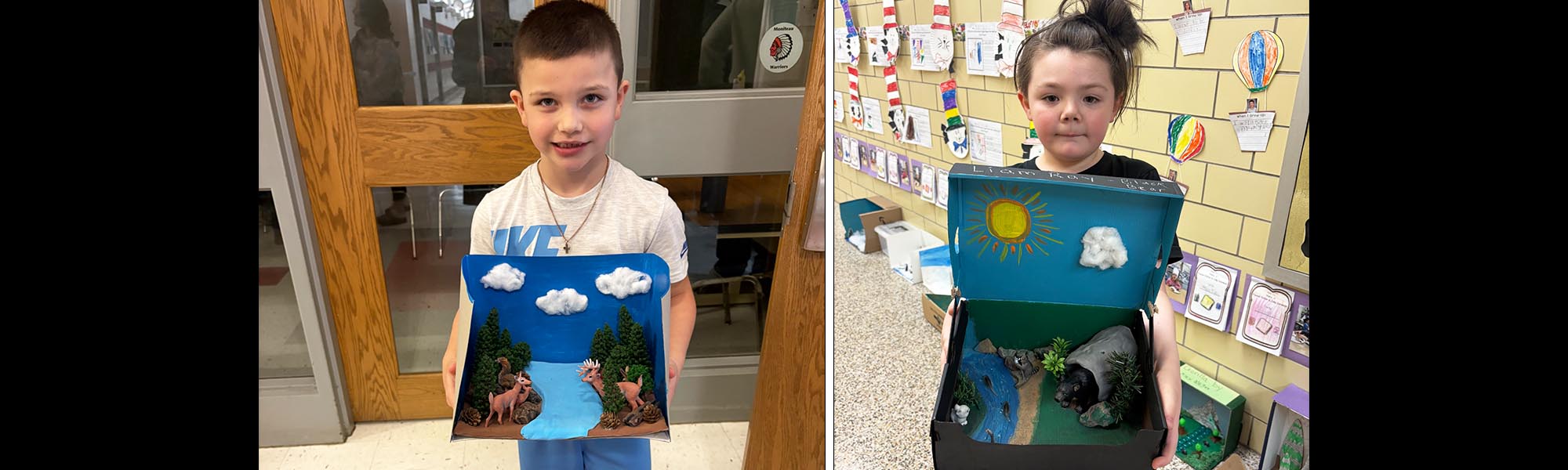 Two elementary students holding up their nature projects