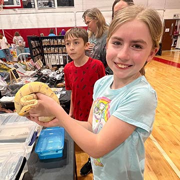 Girl holding a snake