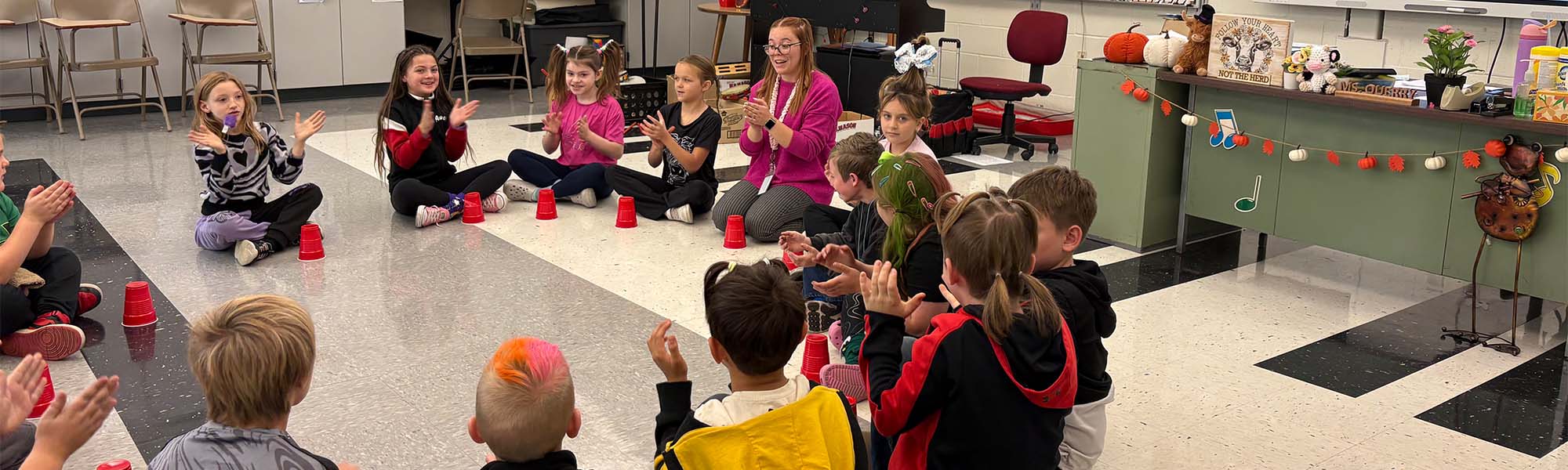 Students in a circle singing