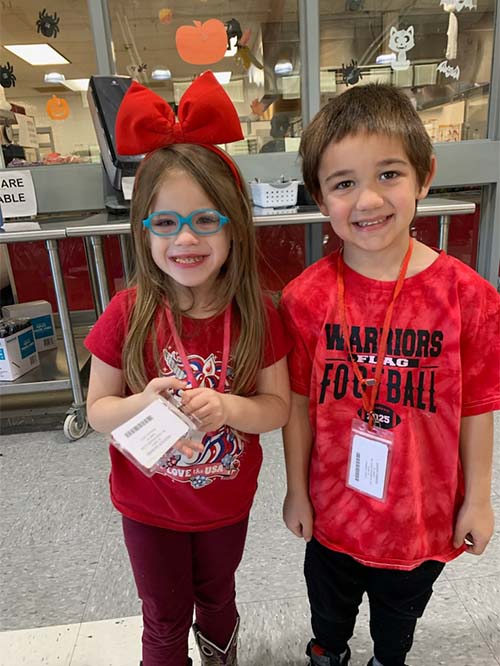 Two students dressed in red