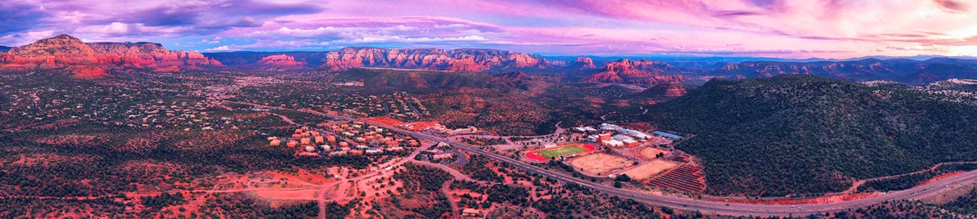 Aerial view of high school campus with a beautiful purple sky