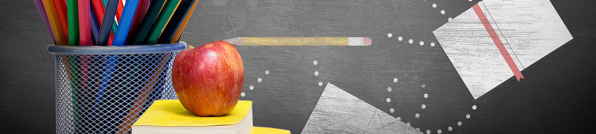 School supplies against blackboard