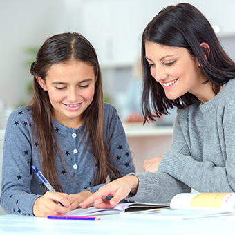 Mom helping a daughter with homework