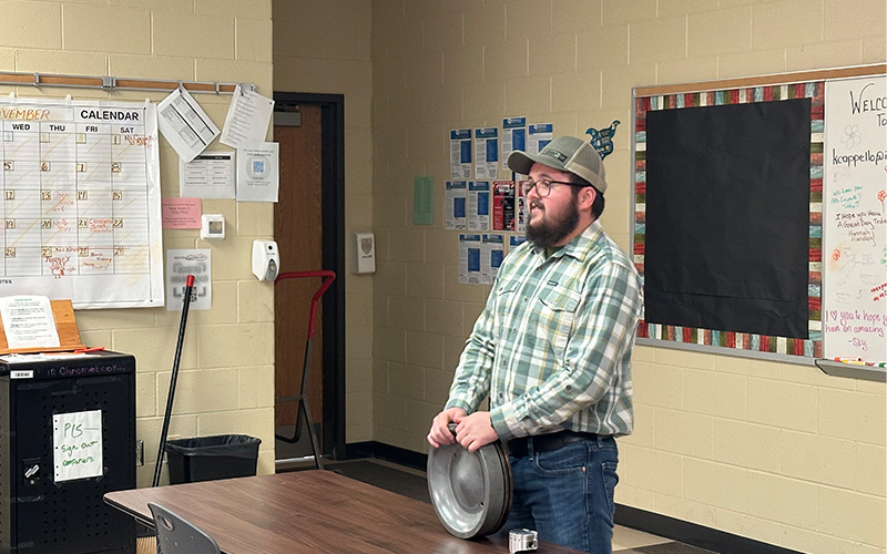 A person speaking to the class