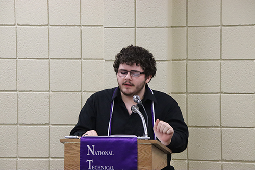 Speaker at the podium for the installation ceremony for the National Technical Honor Society