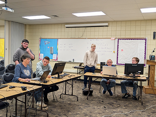 Local residents enjoying a free computer clinic hosted by our students