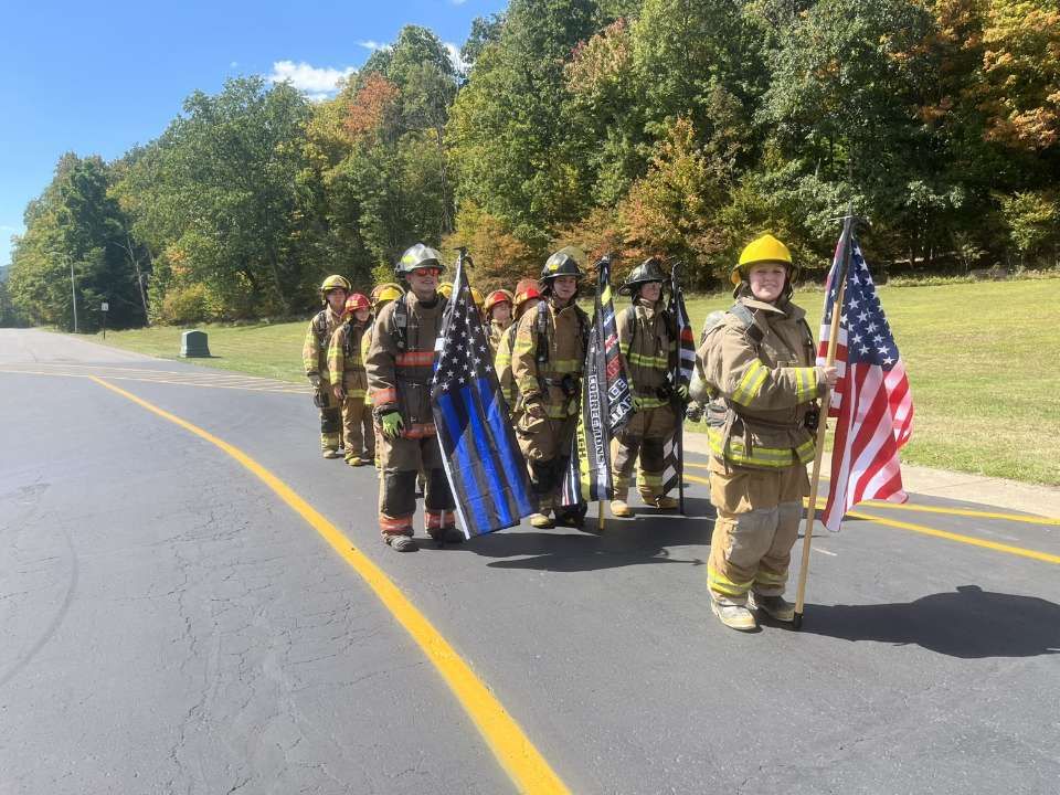 Homeland security students proudly holding up USA flags to honor patriots
