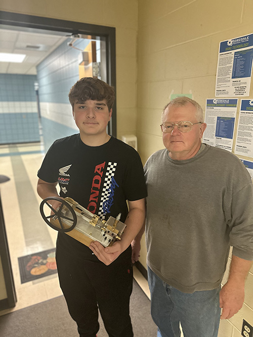 Kinley Charlie and teacher with steam engine