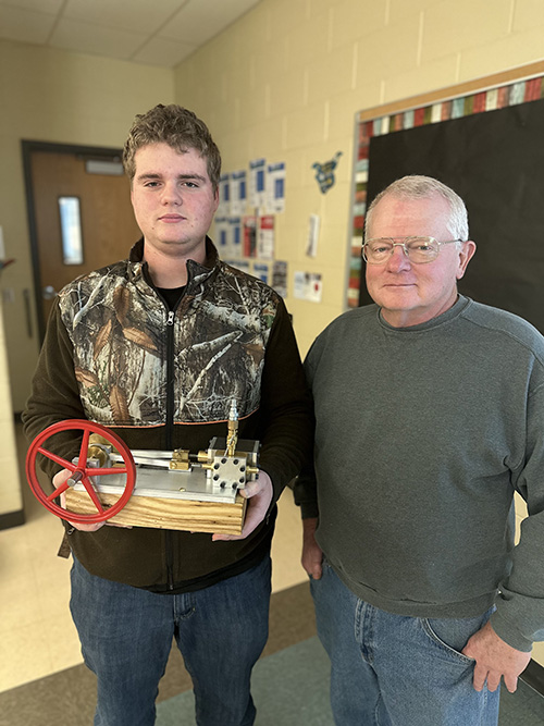 Simon Charlie and teacher with steam engine