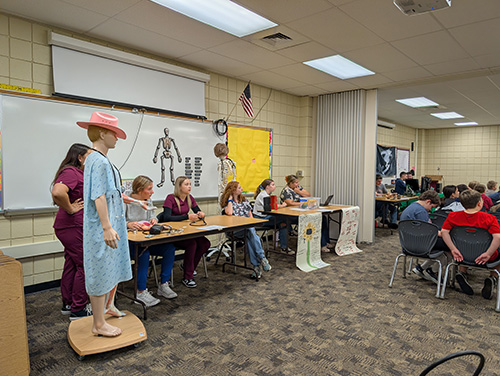 Program presentations displayed for sixth graders on a tour