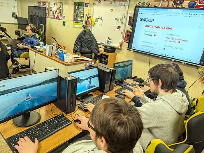 Students focused on beta testing a new, in-development game in the computer lab