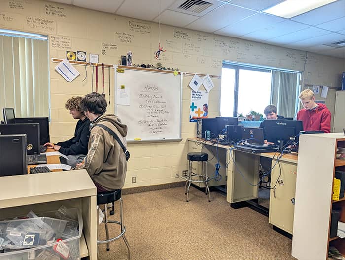 Students sitting in the computer lab testing a new online game