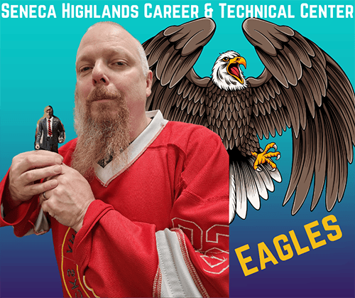 Mr. Bryant holding a mini-figure next to an eagle
