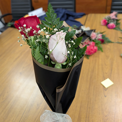 A pink and red rose floral arrangement