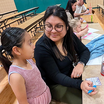 Parent and student enjoying PTO Bingo Night