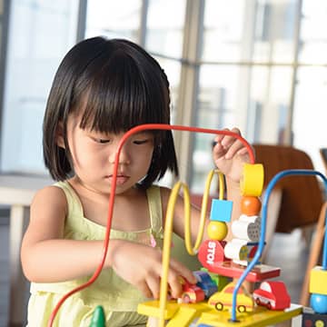 Student working with a bead maze