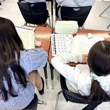 Two students working together in the classroom