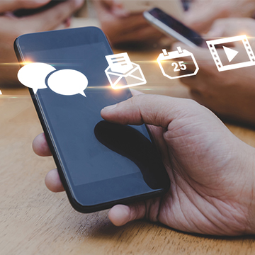 Parent using mobile phone to check school news