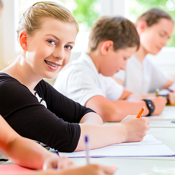 Students working at their desks in a classroom
