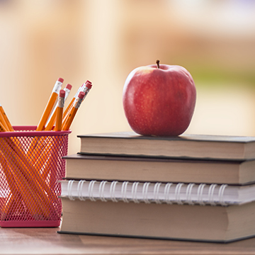 Red apples on a wood table