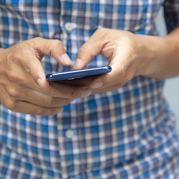 person using their cell phone