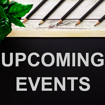 upcoming events sign under pencils
