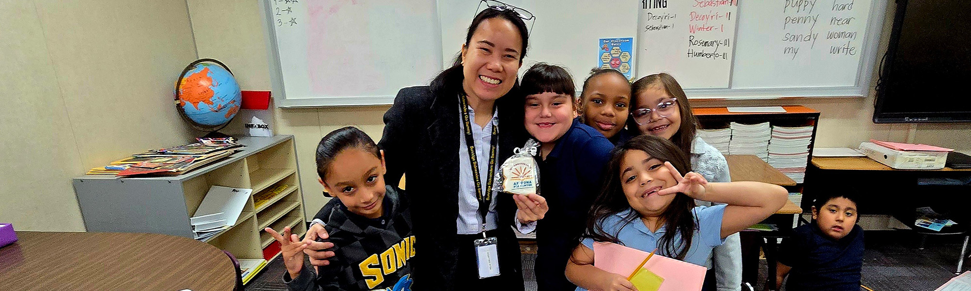 students with an adult in a classroom
