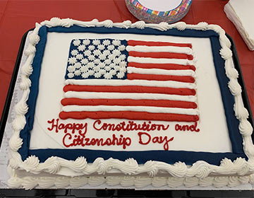 Cake that has the American flag and says Happy Constitution and Citizenship Day on it