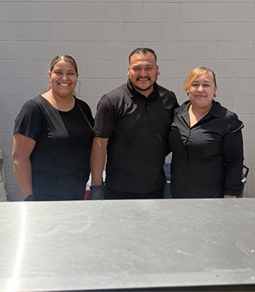 Three smiling employees